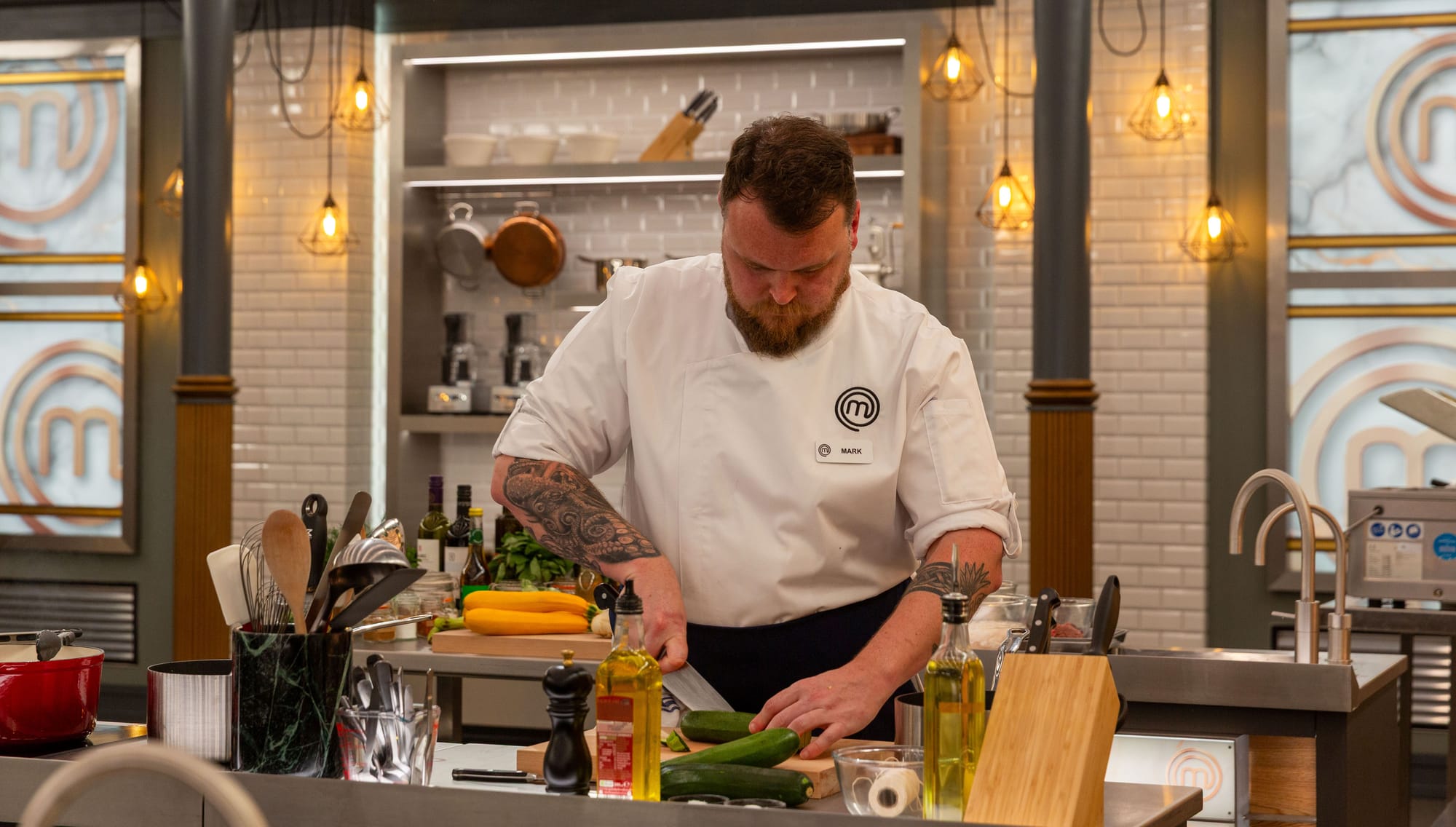 Mark prepping food in TV kitchen
