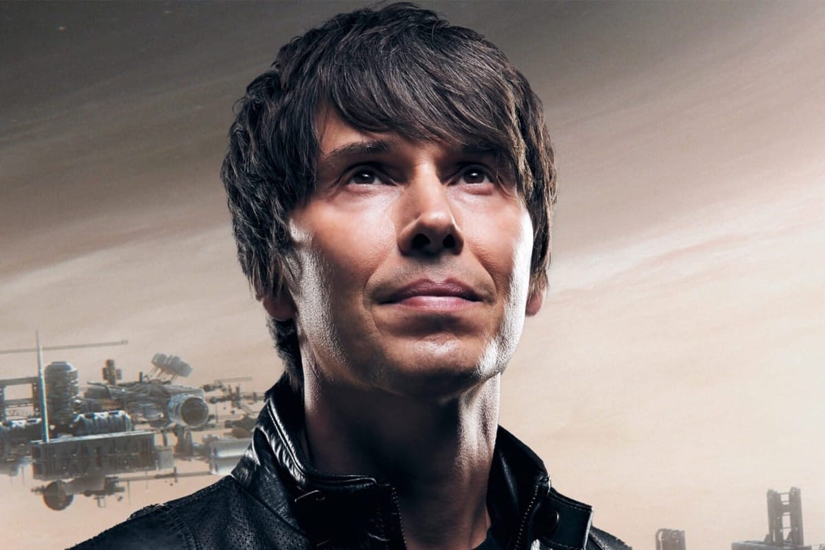 A man looks off into the distant with a spaceship behind him