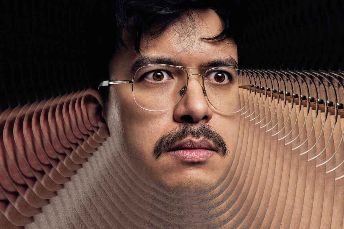 A man with glasses and a moustache