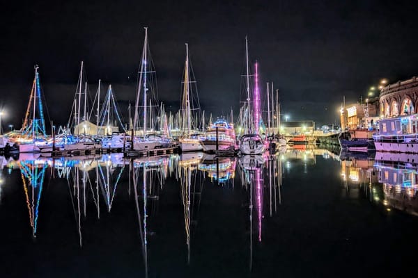 Boats in Ramsgate Harbour illuminated with Christmas lights